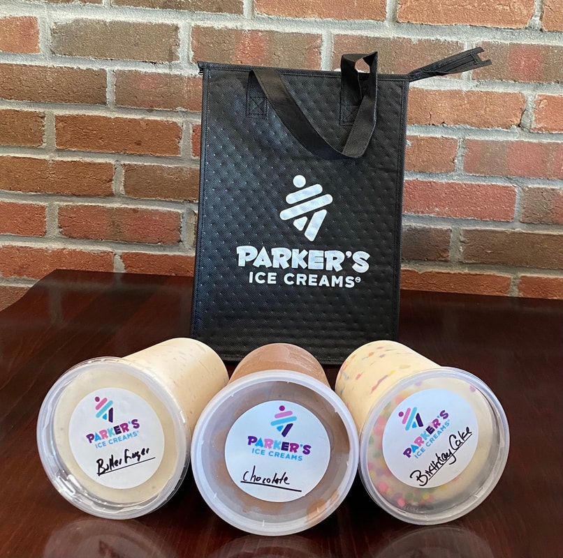 Colorful artisan ice cream scoops in small tasting bowls